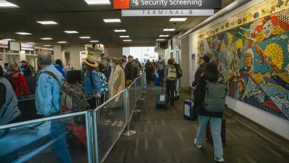 Holiday travelers near the TSA entrance at Terminal B, Philadelphia International Airport on the day before Thanksgiving, November 24, 2021.