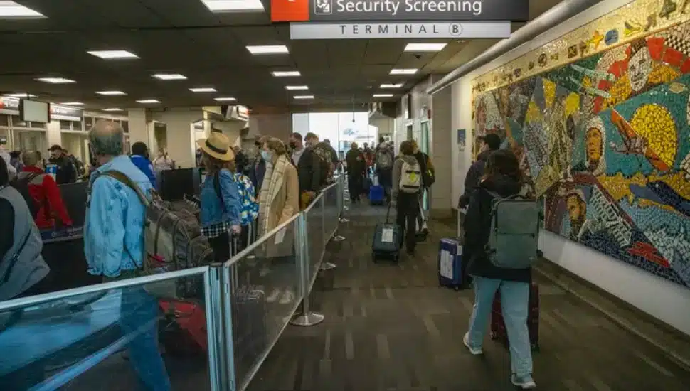 Holiday travelers near the TSA entrance at Terminal B, Philadelphia International Airport on the day before Thanksgiving, November 24, 2021.