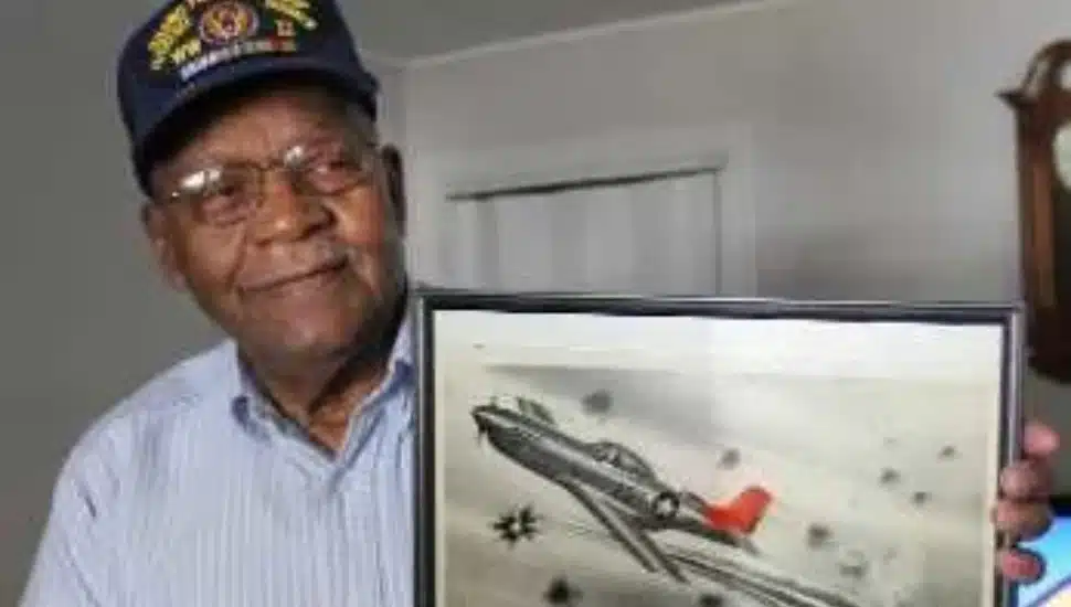 William Rice with an image of his World War II plane, the P-51 Mustang