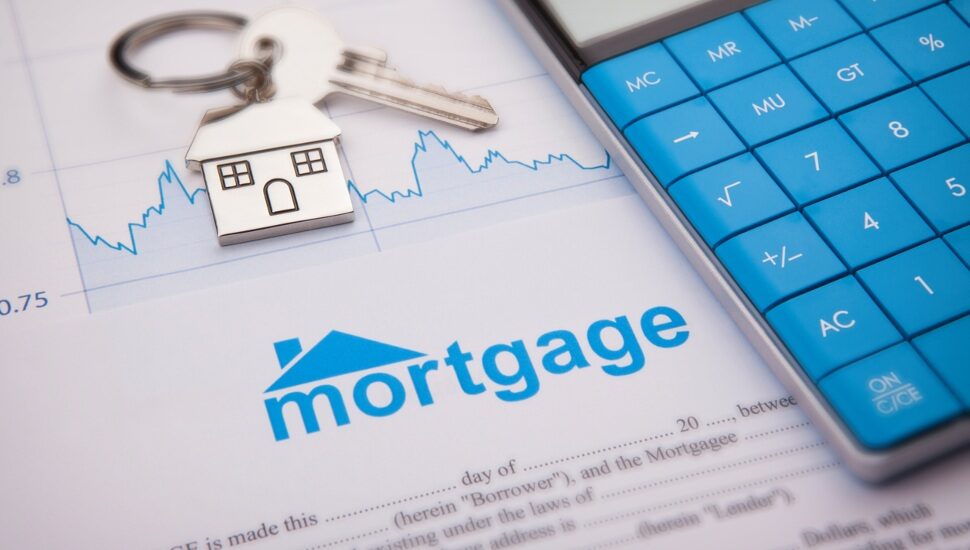 A mortgage document, a calculator and keys