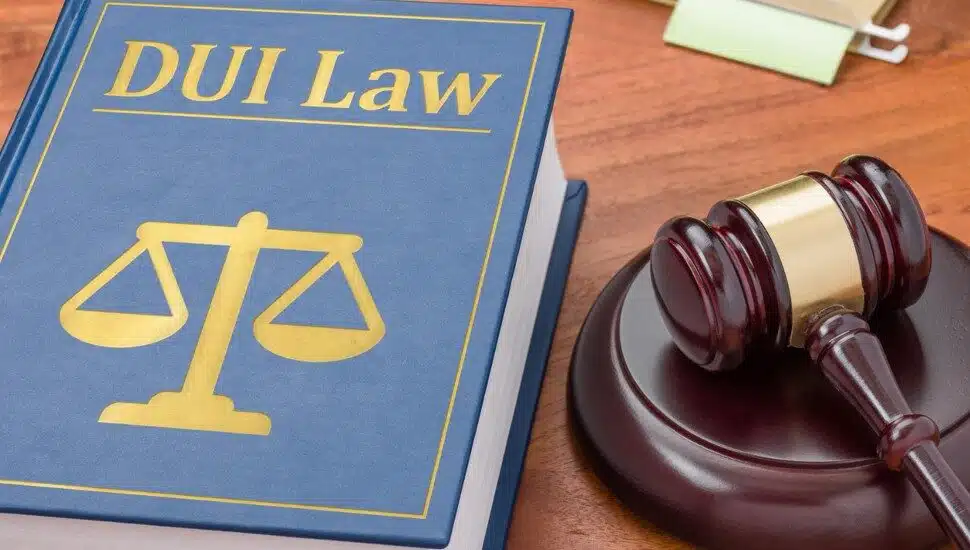 A book on DUI law with a gavel symbolizes the enforcement of Deana's Law in Pennsylvania