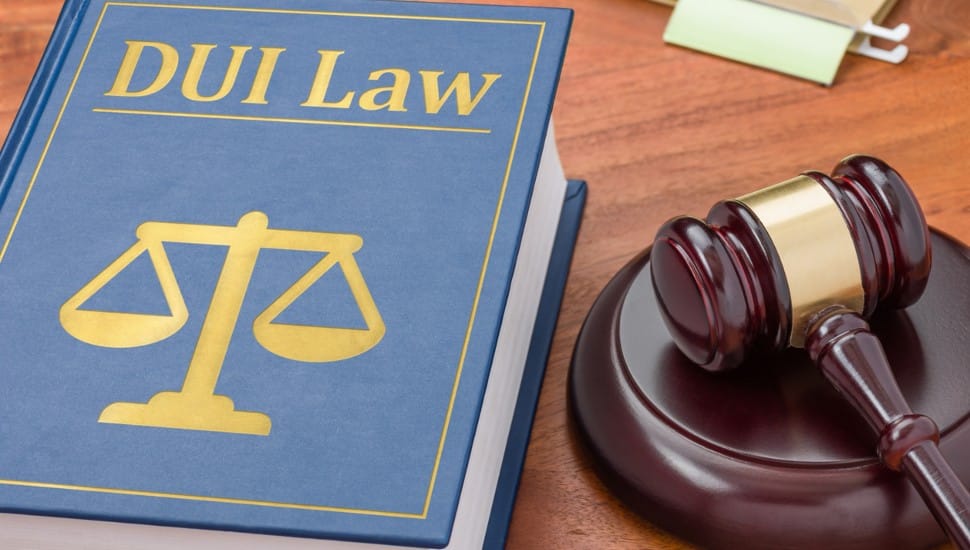A book on DUI law with a gavel symbolizes the enforcement of Deana's Law in Pennsylvania