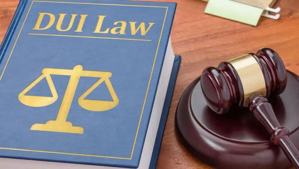 A book on DUI law with a gavel symbolizes the enforcement of Deana's Law in Pennsylvania