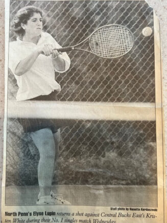 Elyse Lupin playing tennis for North Penn High School.