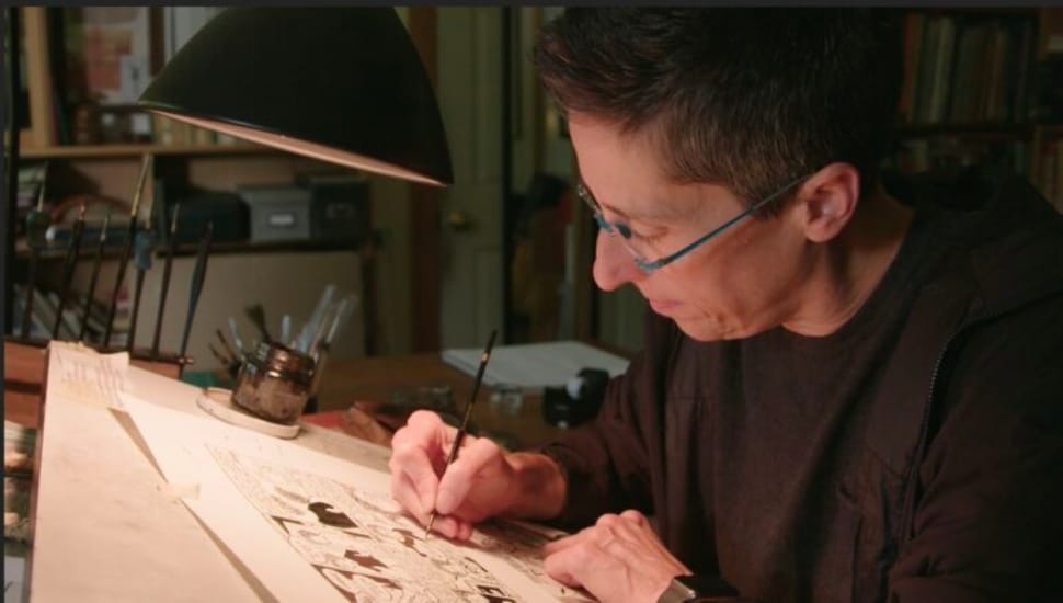 Ash Hoyle working at a desk