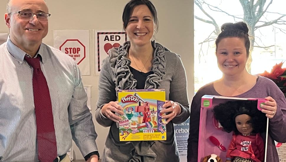 Volunteers participated in the Andrew L. Hicks Jr. Foundation 13th annual Christmas Spectacular toy drive. They are (from left) Joe Vaillancourt, Kara Davison, and Alyssa McKenzie