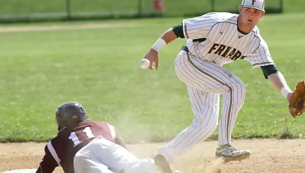 Jim Haley (right) fields a hit in a playoff game against St. Joseph's Prep