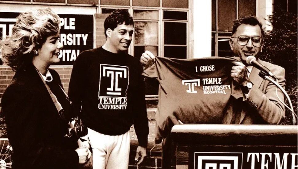 Joe Miceli and his wife, Carol, at Temple University Hospital just before the start of his bike ride, standing next to Temple's president at the time, Peter Liacouras.