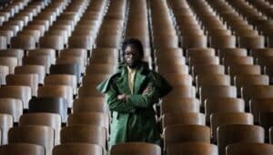 Lansdowne filmmaker Walé Oyejide sits in an empty theater in South Philadelphia