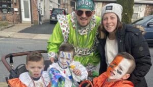 Ridley Township resident Dave Jankauskas, a member of the Froggy Carr Wench Brigade, and his wife Katie, pulled their four children in a wagon in Saturday’s D’Dummers Parade in Ridley Park