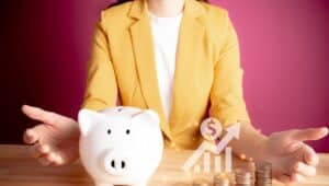 Businesswoman with rows of coins with graph for finance and business concept. coins with piggy bank. Save money for prepare in the future. account finance bank business