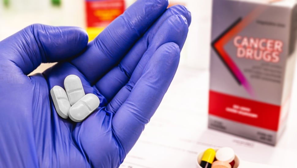 A cancer-fighting drug in the hand of a doctor or pharmacist