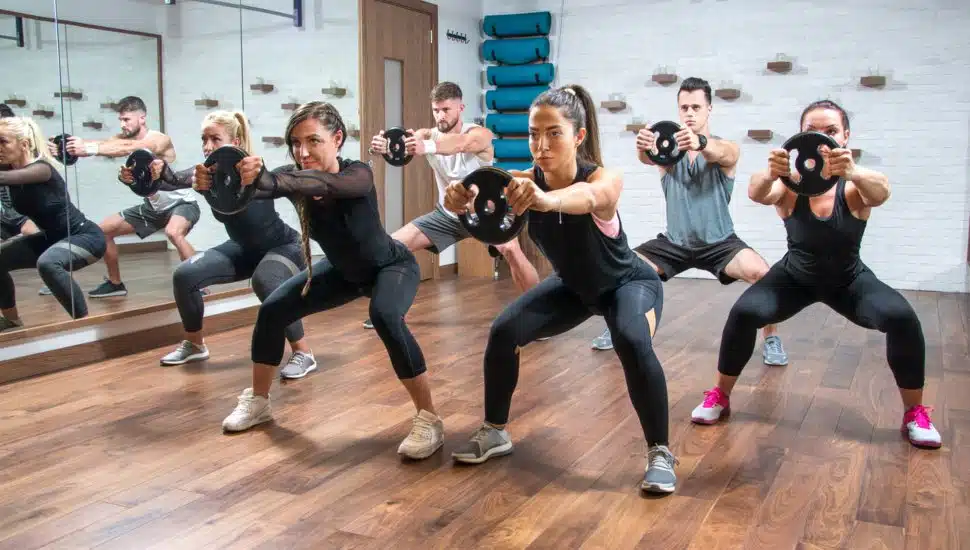 A group of women and men exercising together