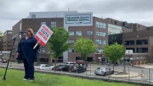 Angela Neopolitano protesting outside Delaware County Memorial Hospital.