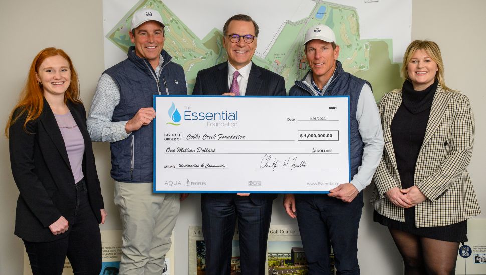 Essential representatives present a donation check to the CCF.