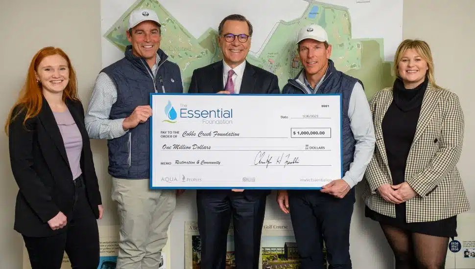 Essential representatives present a donation check to the CCF.
