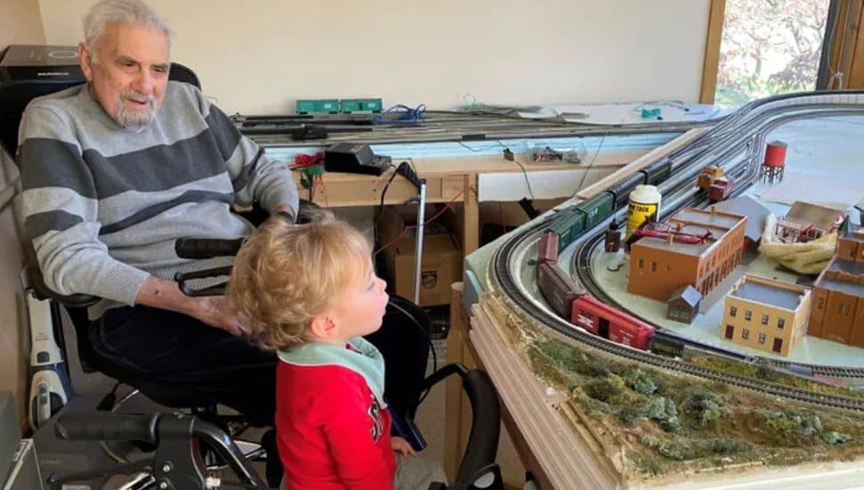 Dr. Richard DeCosmo was a model train enthusiast. He is shown here with his great-grandson takes in a recent layouts.