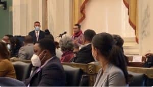 Jonathan Leibovic performs at the Philadelphia City Council meeting voting on creating a zoning exception for renovations at the Cobbs Creek Golf Course