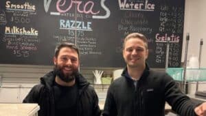 The new owners of Vera's Water Ice in Springfield, Richie Gallo and Lou Farese, stand behind the counter of the store