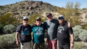 (From left) Tom (no last name given), Denny Alessandrine, Jim Wallin and Mike Daggett, all originally from Southwest Philadelphia, posed for a portrait at the Pima Canyon Trailhead in Phoenix