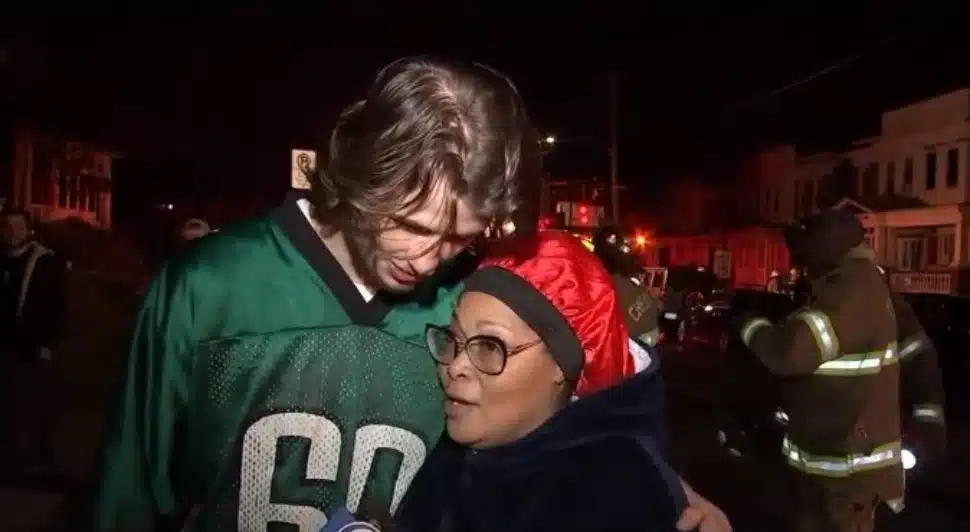 College student Jarrett Niland and Chester resident Charmaine Burrell after a fire on her street