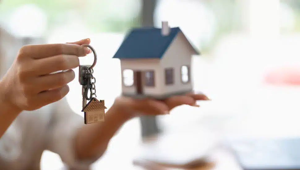 Real estate agent handing over keys to a home