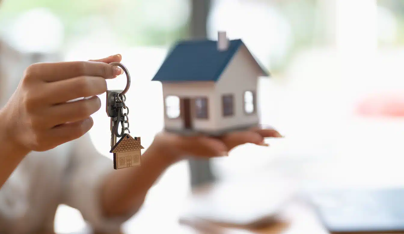Real estate agent handing over keys to a home