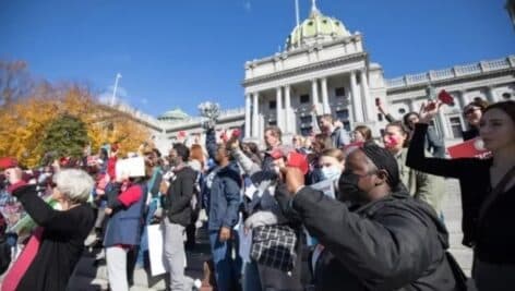 Supporters participate in a school funding rally on the steps of the Capitol Building in Harrisburg