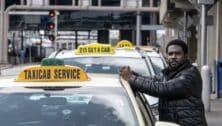 Taxi driver Frederick Andoh waits for a customer at Philadelphia International Airport