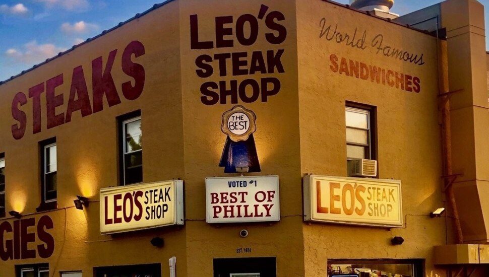 The outside building with signs at Leo's Steaks in Folcroft