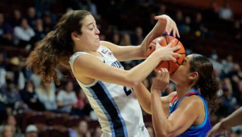 Maddy Siegrist (left) of Villanova battles for the ball with Anaya Peoples of DePaul during the first half of a Big East Tournament quarterfinals game