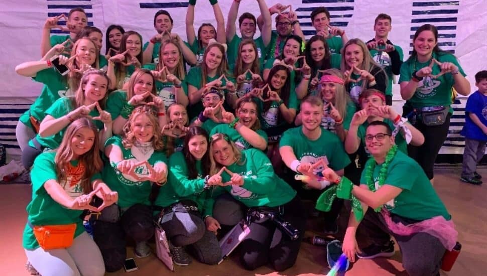 Lexi Murphy-Costanzo joins a group photo promoting fundraising for THON