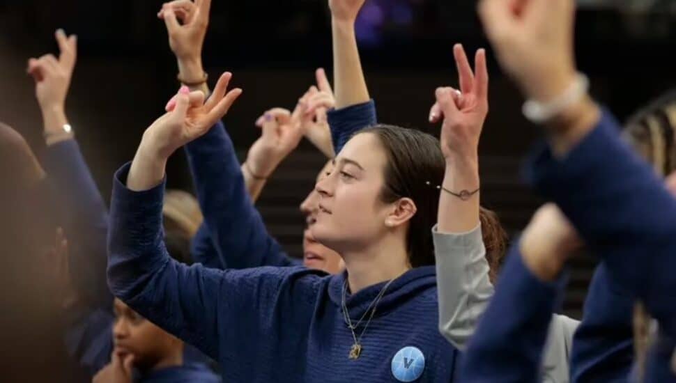 Maddy Siegrist and the Villanova women's basketball team salute the fans after the Selection Sunday show