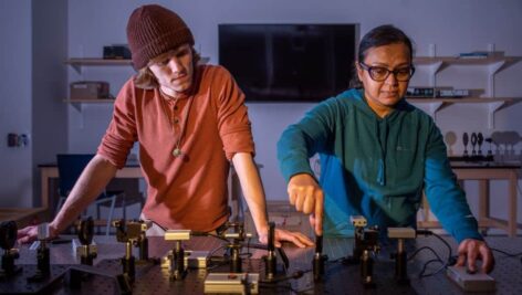 WCU physics students Chris Barns and Rumana Alam are pictured aligning a quantum cryptography experiment.