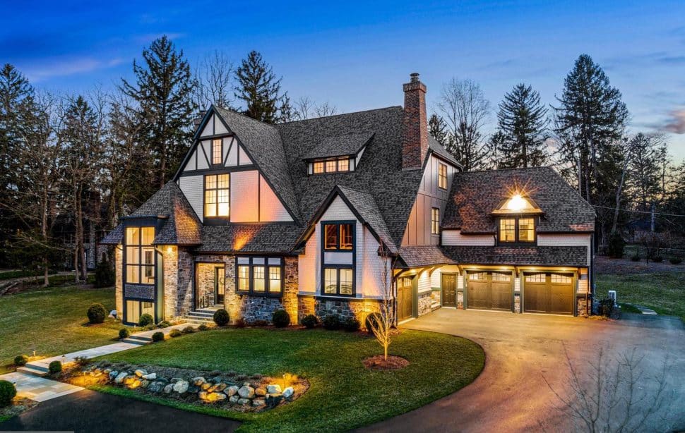 A contemporary home lit at night at 10 Tunbidge Road in Haverford