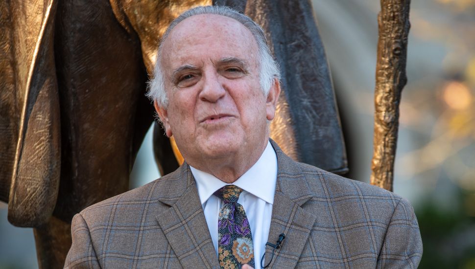 Former State Senator Andrew E. Dinniman speaks on the campus of West Chester University in front of the statue of famed abolitionist, orator, and statesman Frederick Douglass.