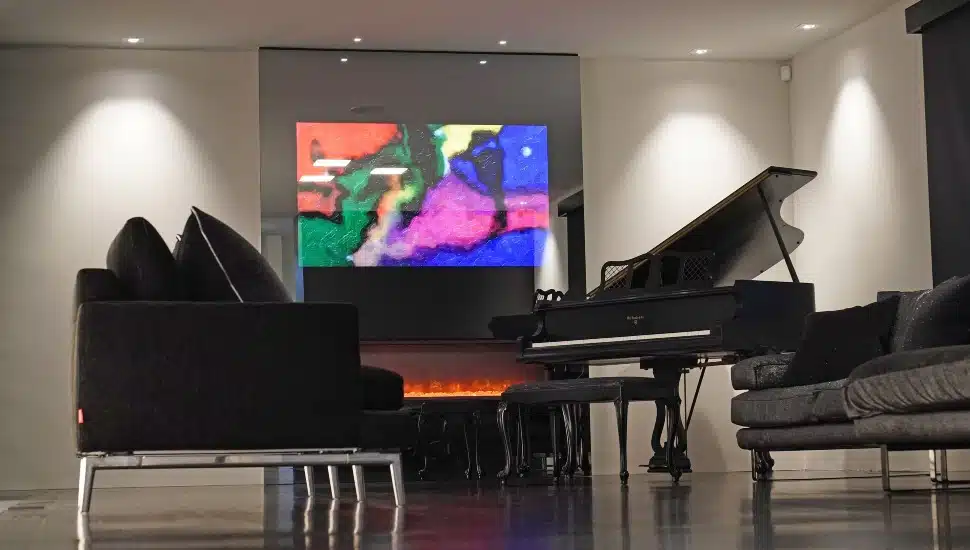 A piano, artwork, a gas fireplace and furniture are part of the interior redesign of a childhood home in Broomall