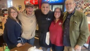 Johnny Paisano, owner of Johnny Paisano's Restaurant, center, with longtime customers Lourdes and Dan Devenney of Broomall, left, and Jennie and Dennis Todd of Springfield, right.