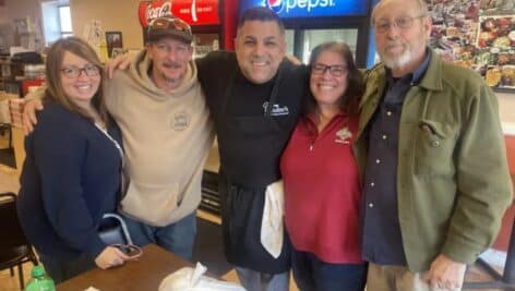 Johnny Paisano, owner of Johnny Paisano's Restaurant, center, with longtime customers Lourdes and Dan Devenney of Broomall, left, and Jennie and Dennis Todd of Springfield, right.