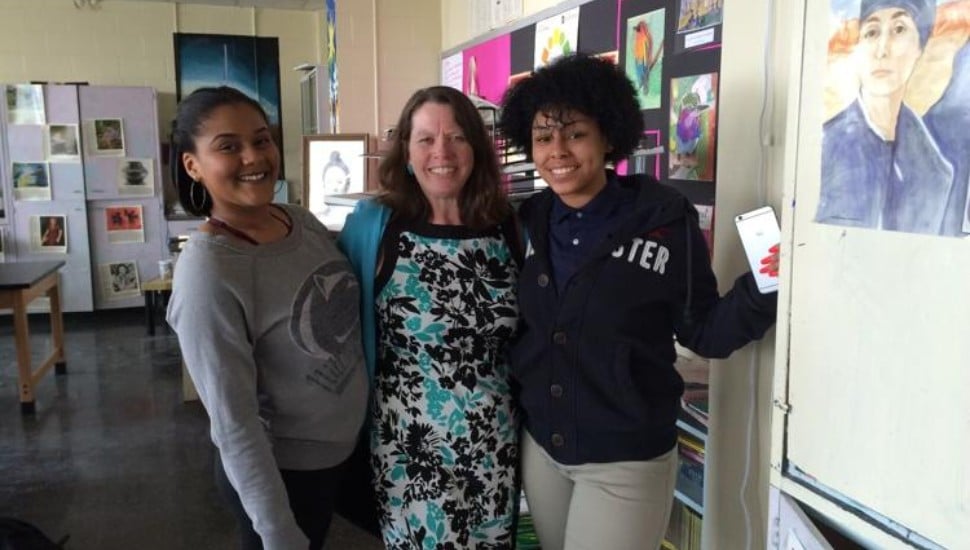 Mary Pat Ford stands with two students at Pennsauken High School in Pennsauken Township