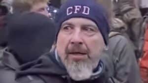 Robert Sanford Jr. in a still from a video taken at the U.S. Capitol on Jan. 6. The "CFD" or Chester Fire Department cap was a clue that led to his arrest