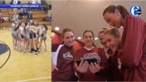 The girls check themselves out on a video of the their championship game in Altoona