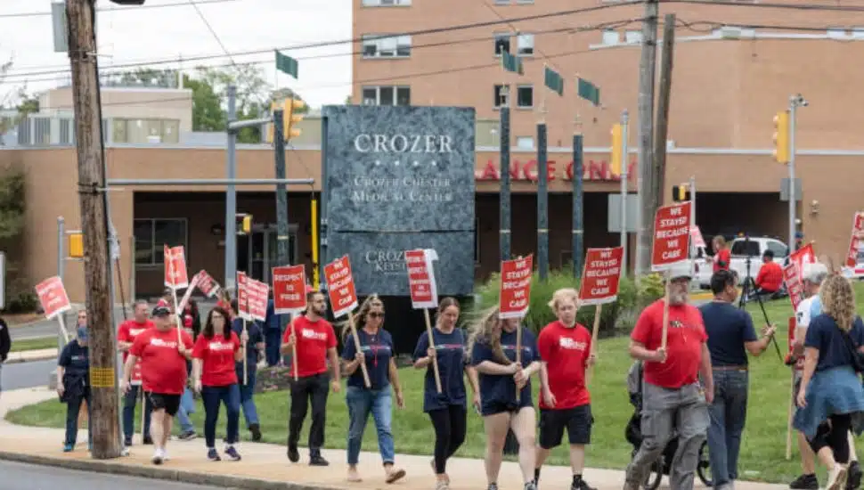 Protesters march outside the Crozer-Chester Medical Center in Chester.