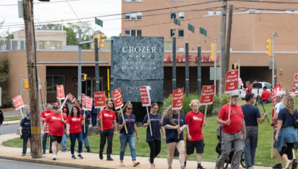 Protesters march outside the Crozer-Chester Medical Center in Chester.