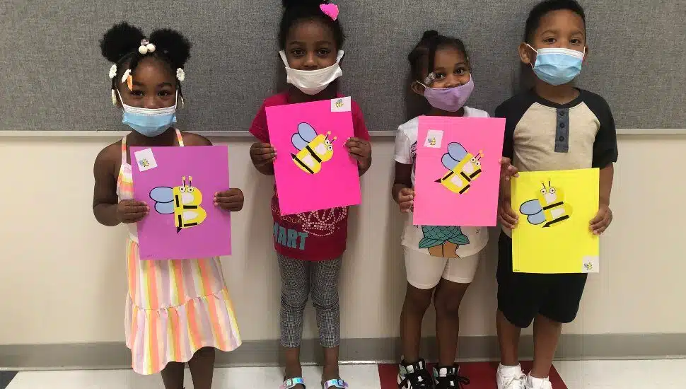 Children from the Chester Charter Scholars Academy showing a school project.