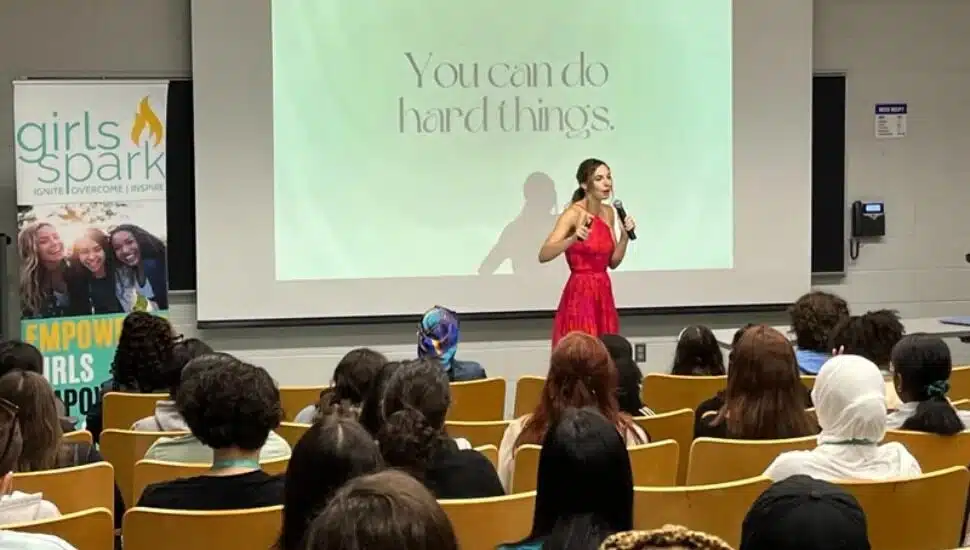 A speaker addresses girls at the 2023 Girls Spark Summit at Penn State's Brandywine.