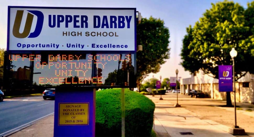 The Upper Darby High School marquee with the school campus in the background