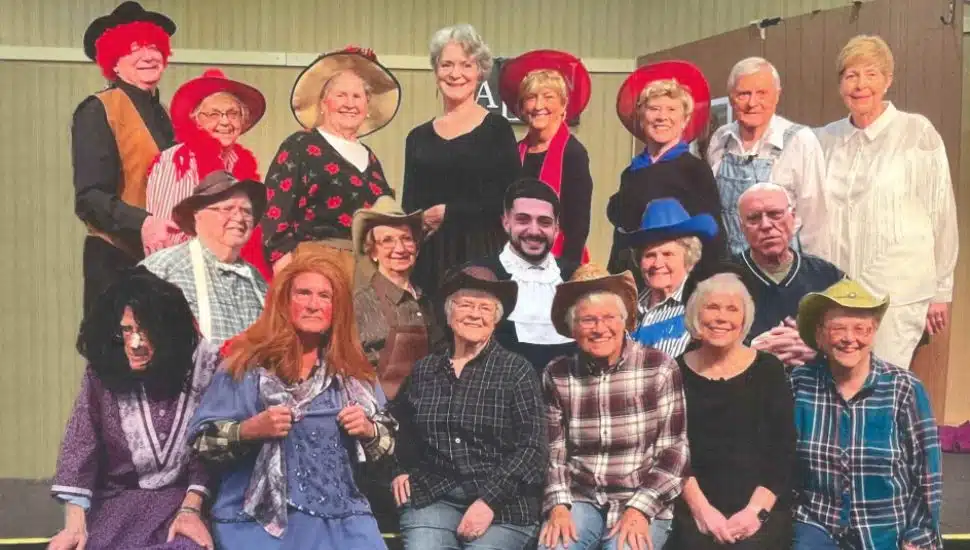 The Village Player performers in a production of Way Out West in a Dress