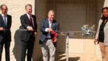 Chuck McLister cuts the ribbon in September on the Addison Hines Children’s Residential Treatment and Learning Center on the Elwyn campus