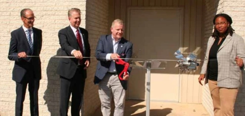 Chuck McLister cuts the ribbon in September on the Addison Hines Children’s Residential Treatment and Learning Center on the Elwyn campus